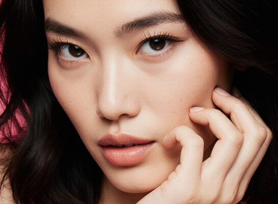 beauty aesthetic trends 2026 face asian woman black hair pink background